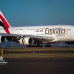 International travelers at a major Middle East airport during tourism growth expansion