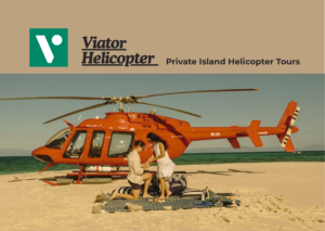 Luxury helicopter flying above a tropical private island with crystal clear ocean views