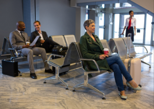 Premium lounge inside Dubai International Airport Terminal with luxury seating, dining area and passenger facilities.