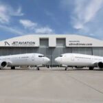 Jet Aviation business jet parked at a modern executive airport showcasing premium private aviation services and aircraft management.